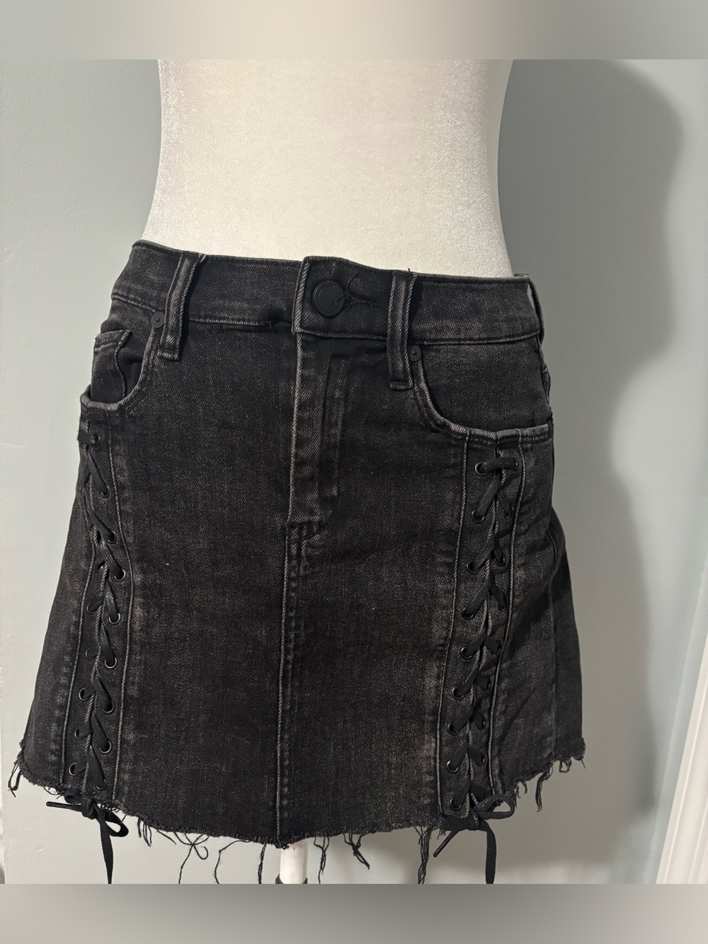Blank NYC Black Lace-Up Denim Mini Skirt with Frayed Hem